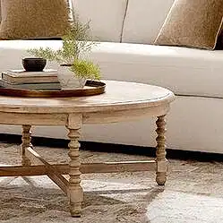 Wood cocktail table in front of beige sofa